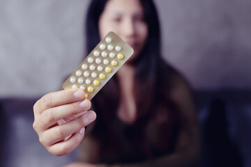 Women carry birth control pills