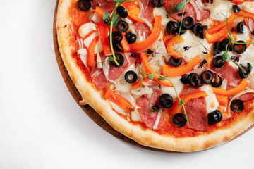 Italian pizza with olives, pepper and herbs. Copy space.