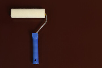 Obraz premium paint roller dark brown background