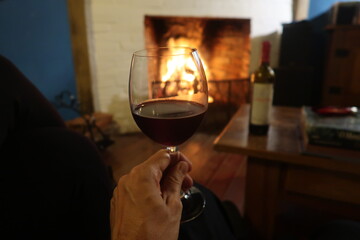 glass of wine and firewood