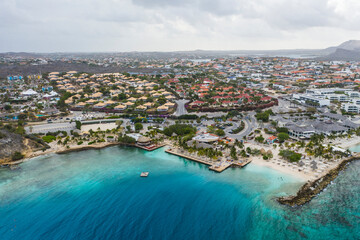 Aerial view of coast of Curaçao in the Caribbean Sea with turquoise water, cliff, beach and beautiful coral reef