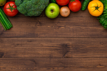 Healthy eating ingredients: fresh vegetables, fruits and superfood. Wooden background