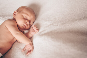 Cute emotional newborn funny little baby boy sleeping in crib. Baby goods packaging template....