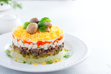 Beautiful festive layered salad with chicken, potatoes, carrots, pickles and fried champignons, copy space