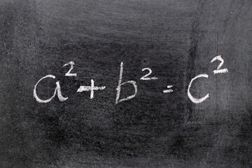 White color chalk hand writing in mathematics formula (Pythagorean theorem or Pythagoras's theorem)...
