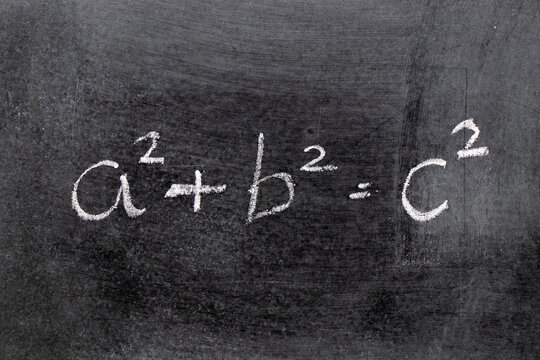 White color chalk hand writing in mathematics formula (Pythagorean theorem or Pythagoras's theorem) on blackboard background