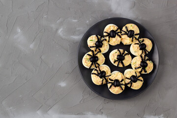 Deviled Eggs With A Spider For Halloween Party.