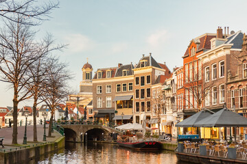 Afternoon view of the Nieuwe Rijn canal with bridge and historic buildings in the city center of...