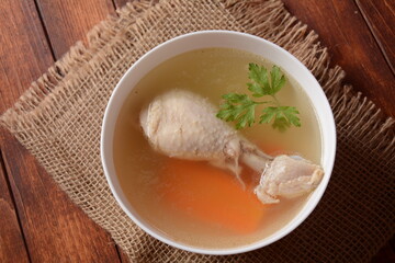 Chicken bouillon broth,  boiled meat chicken leg. 