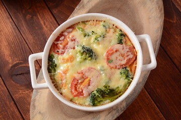 Broccoli, cheese and  egg casserole in baking cocottes