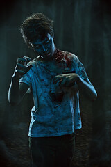 portrait of aggressive zombie boy