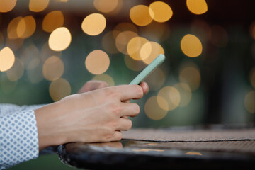 Hands hold smartphone