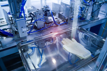 automatic machine for the manufacture of medical protective gloves. Coronavirus and Covid-19 Protection