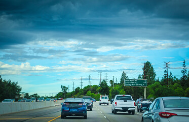 Traffic in a freeway on a cloudy day in California