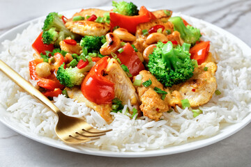 Asian cashew chicken on a white marble background