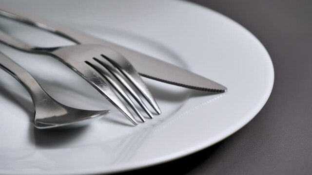 clean cutlery,fork with knife and spoon- studio light effect