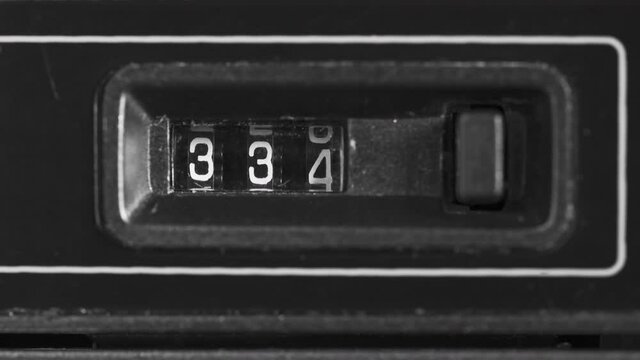 Macro time lapse view of a retro 80s cassette tape counter.