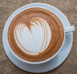 Delicious, aromatic and freshly made cappuccino with a pattern