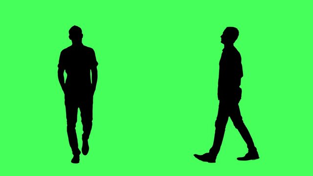 Silhouettes of confident business man walking with hands in pockets. Front and side view. Full body on green screen chroma key background.