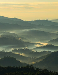 Beautiful Landscape of mountain layer in morning sun ray and winter fog at Doi Hua Mae Kham, Mae Salong Nai, Chiangrai, Thailand