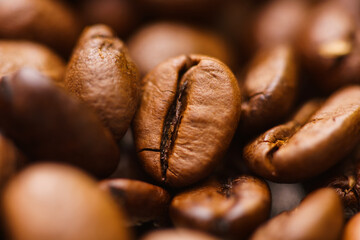 Macro view of roasted coffee beans. Out of focus background.