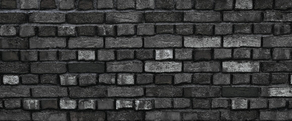 Obraz premium Black clinker bricks from a wall, facade of brick, texture wallpaper