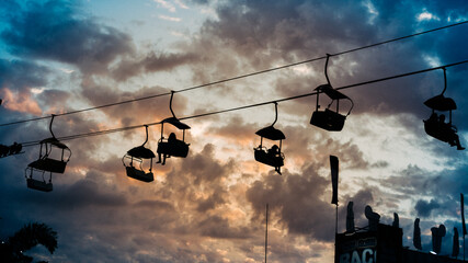 Silhouette of a gondola lift at a state fair