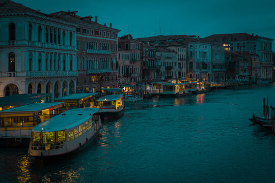 Enchanting Venice In Night Time Or Evening Light During Blue Hour. Canal In Venice With No Traffic, Calm During A Rainy Season With Not Much Tourists Due To Coronavirus Or Covid.