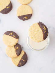 Coconut, chocolate and lime cookies on a marble background