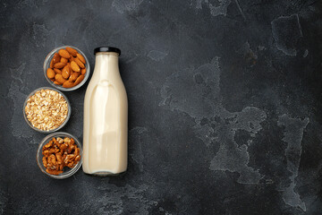 Vegan non dairy nut milk and heaps of different nuts top view