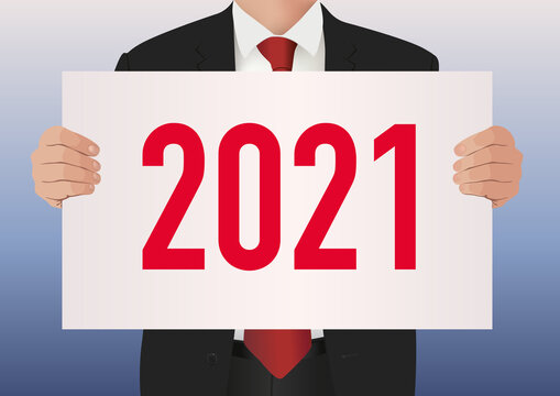 Pour présenter le bilan de son entreprise, un cadre dirigeant en costume cravate, porte une pancarte blanche sur lequel est écrit l’année 2021