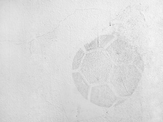 traces of soccer ball imprint on old white concrete wall, dirt stain on cement surface caused by...