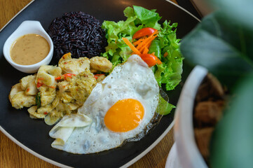 Rice berry and Green Curry With Chicken,fried egg.Clean food and good health for diet concept.