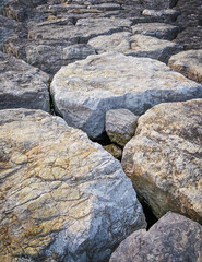 Fototapeta na wymiar Long Shore stones, rocks pier