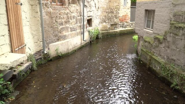 Old street with canel river water in ally with Europe stone house building vintage italy style