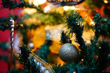 Brilliant Christmas ball on a golden Christmas tree