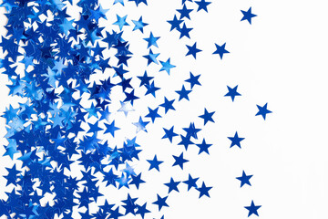Fototapeta na wymiar Christmas background with blue star confetti. Holiday background for New Year