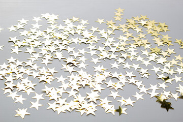 Christmas background with gold star confetti. Holiday background for New Year