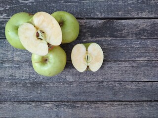 green apples on wooden table