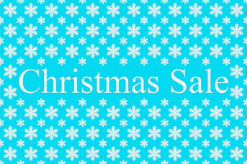 Christmas sale and snowflakes on a blue background, top view. Background for new year and winter sales. Seasonal discounts in stores. Final sale, purchase concept, banner for stores