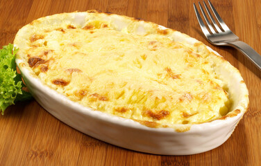 Potato au Gratin on wooden Background