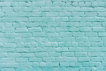 Large texture of light blue brick wall, textured surface. Brick background. Pastel blue brick wall....