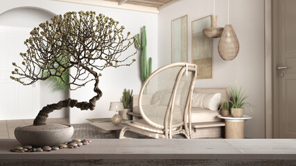 Obraz premium Vintage wooden table shelf with pebble and potted bloom bonsai, white flowers, over scandinavian ethnic living room, sofa, capet and succulents, zen clean architecture concept idea