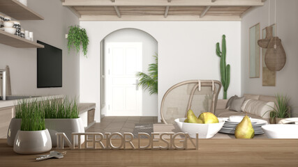 Wooden table, desk or shelf with potted grass plant, house keys and 3D letters making the words interior design, over blurred modern kitchen, project concept copy space background
