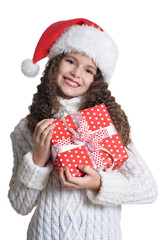 Portrait of smiling little girl with Christmas present