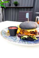 Modern black burger with meat