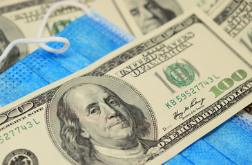 Dollars and the medical mask.