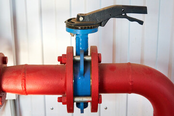 A gate valve on the hot water supply pipeline.