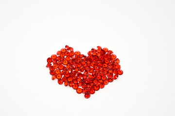 Red heart. Bugle, close-up, white background.