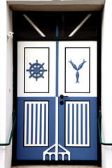 Fototapeta premium White and blue decorated front doors - marine decoration